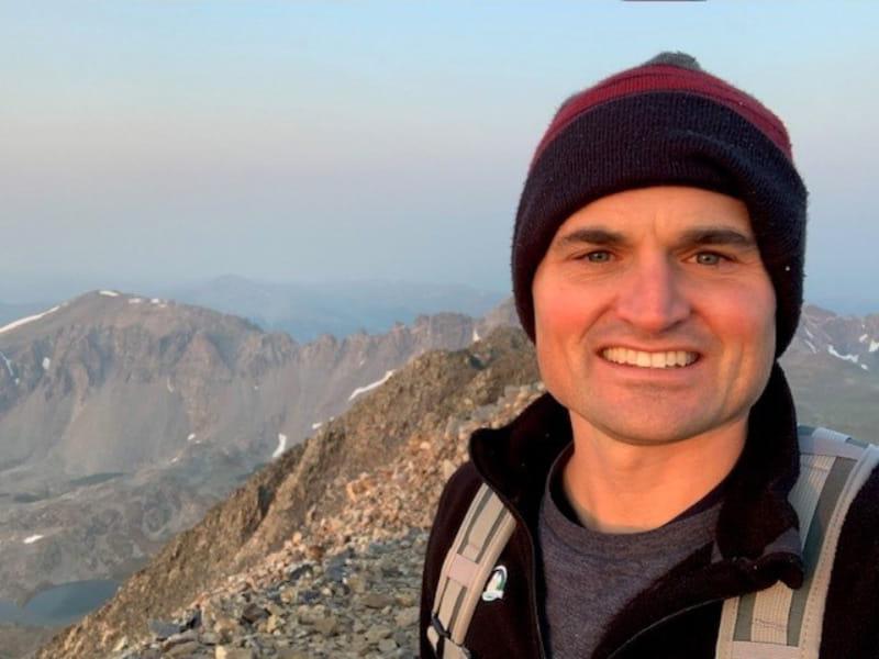 Dr. William K. Cornwell on the 14,271-foot summit of Quandary Peak, near Breckenridge, Colorado in August 2020. (Photo courtesy of Dr. William K. Cornwell)